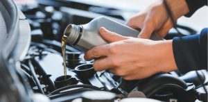 Filling car with Bottle of Vehicle Oil